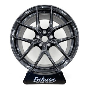 554M style alloy wheel in gloss black on the Exclusive Mods Parts display stand, front view