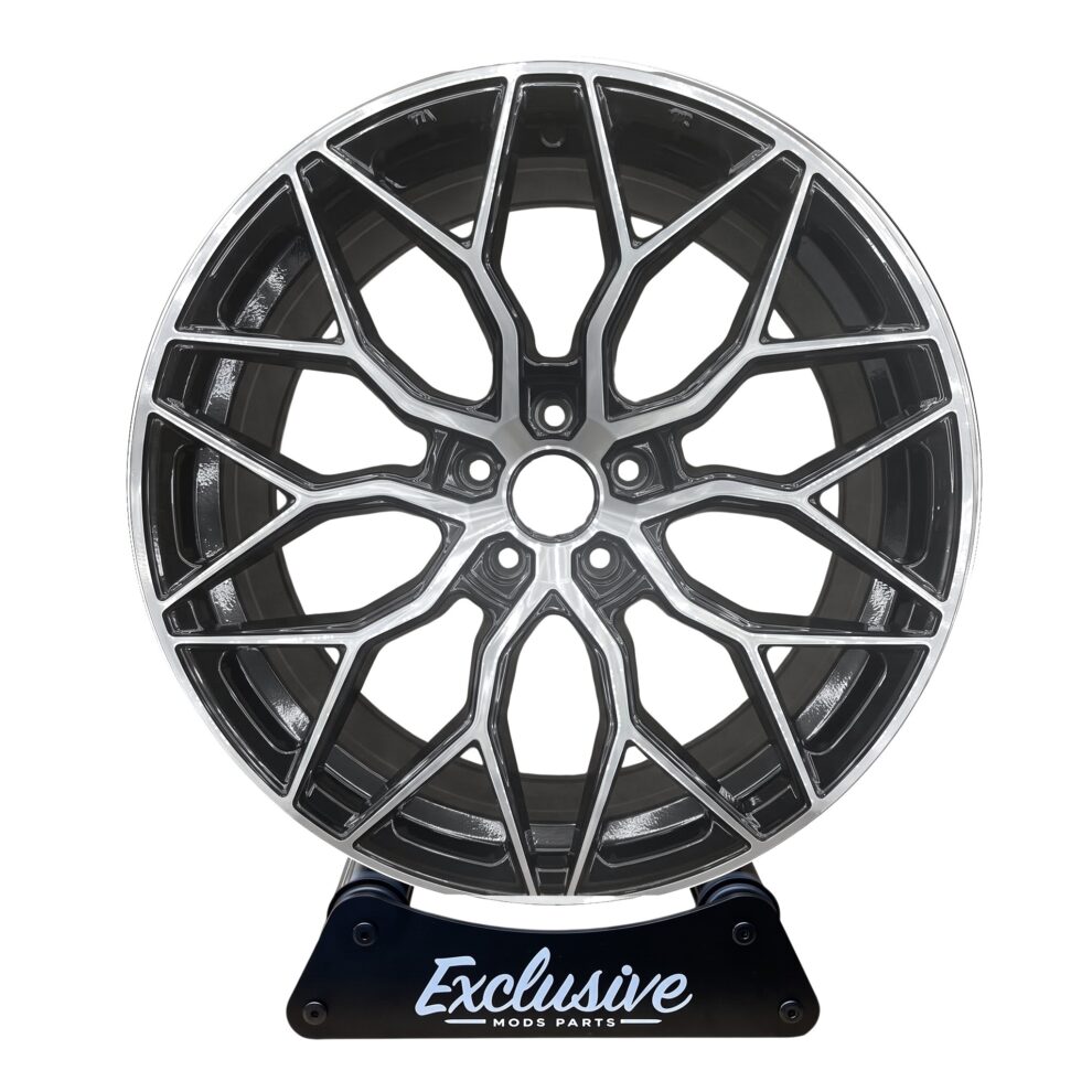 BMF style alloy wheel in gloss black with a diamond cut face on the Exclusive Mods Parts display stand, front view