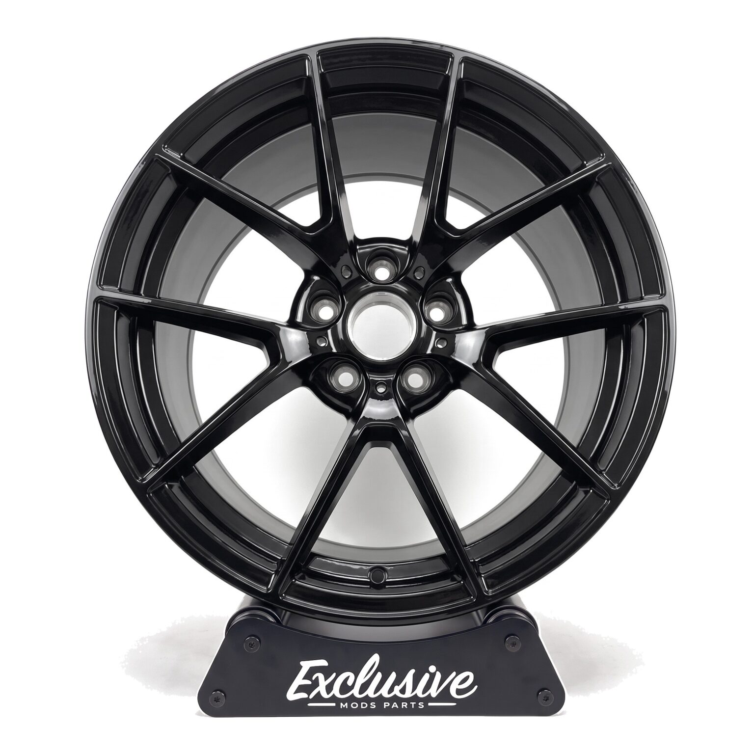 763M style alloy wheel in gloss black on the Exclusive Mods Parts display stand, front view