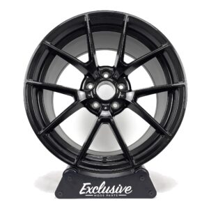 763M style alloy wheel in gloss black on the Exclusive Mods Parts display stand, front view