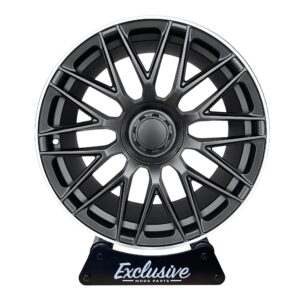 C63 AMG 10-Spoke Style alloy wheel in satin black with a machined silver lip, on a display stand