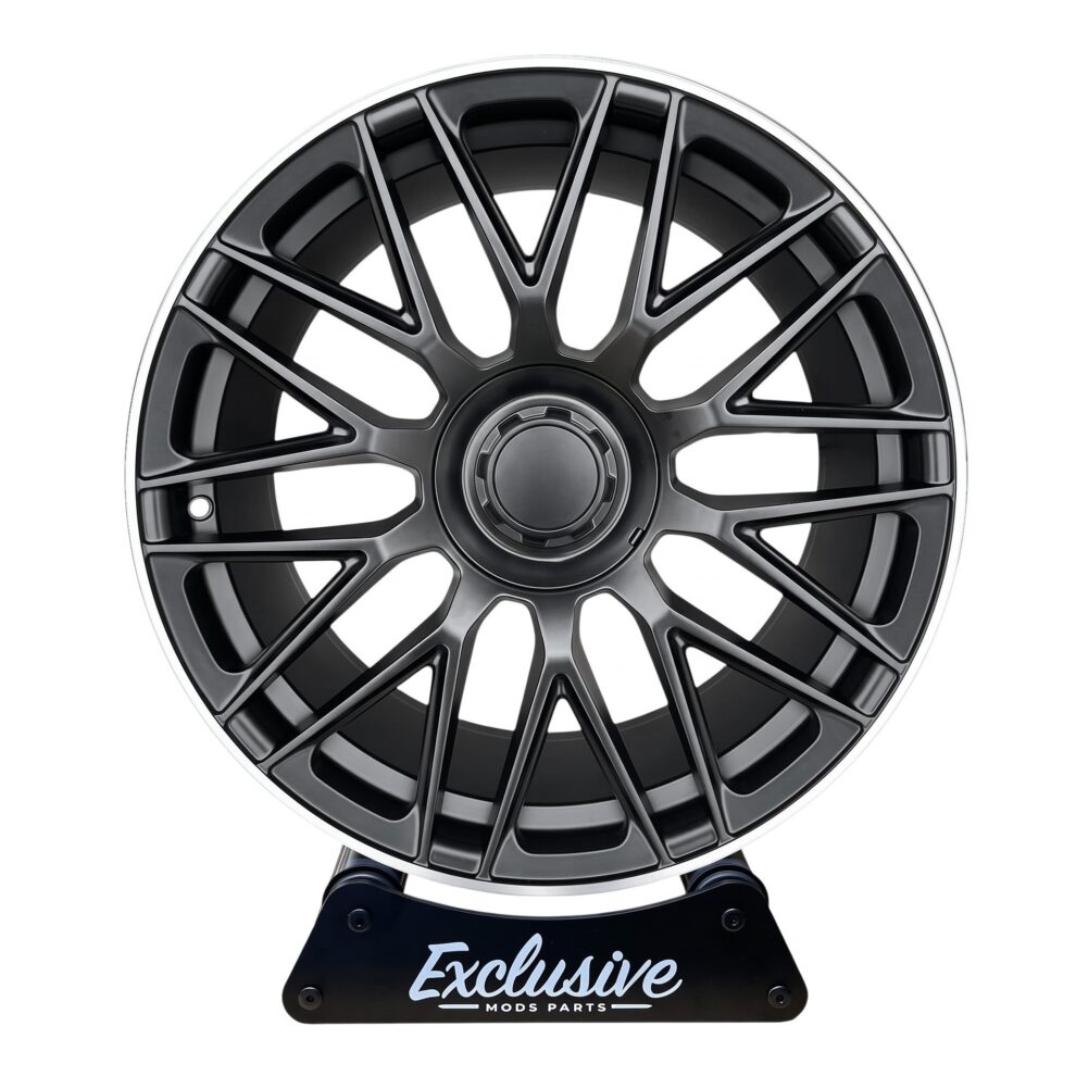 C63 AMG 10-Spoke Style alloy wheel in satin black with a machined silver lip, on a display stand