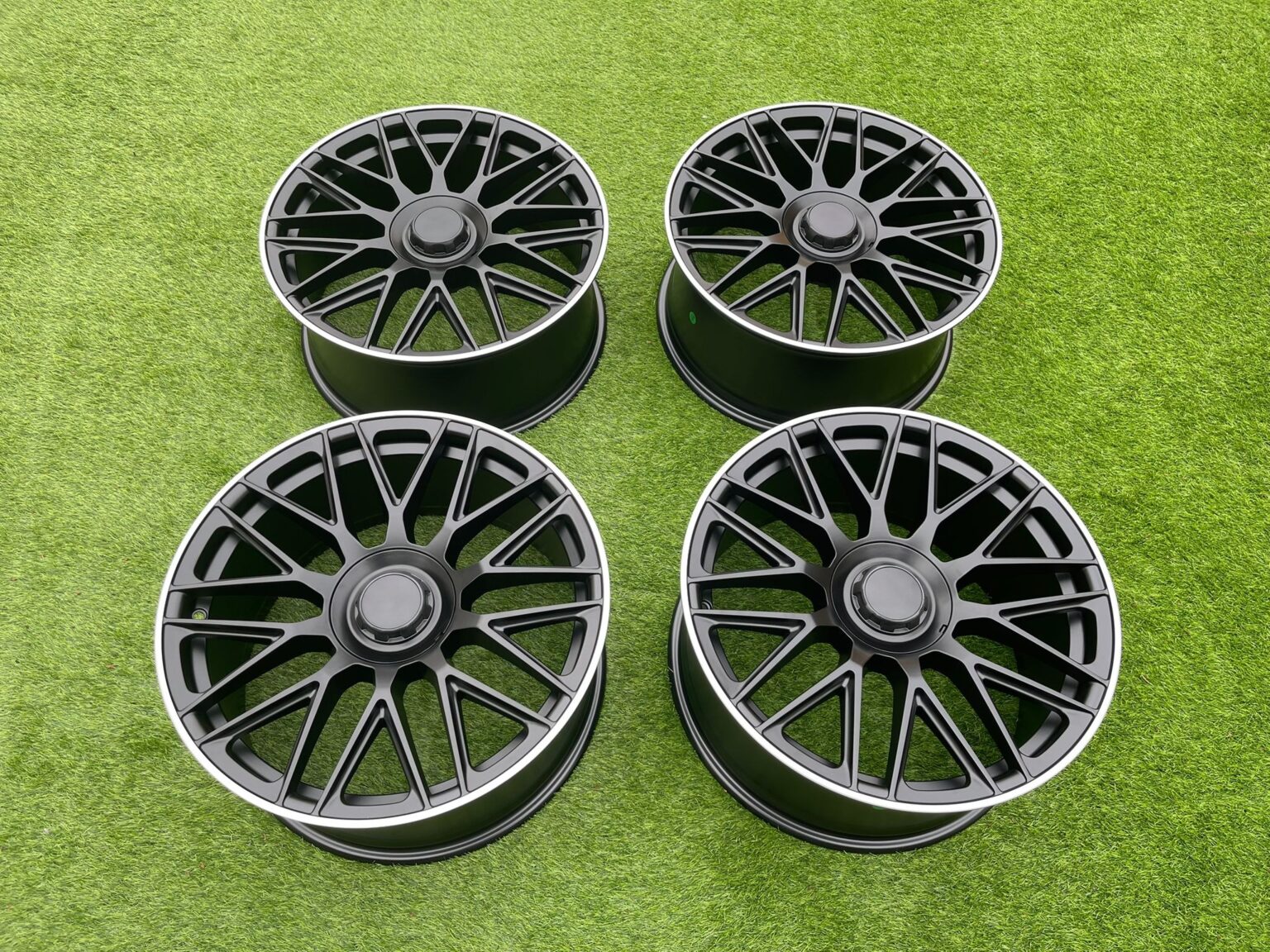 Set of four C63 AMG 10-Spoke Style satin black alloy wheels, top view