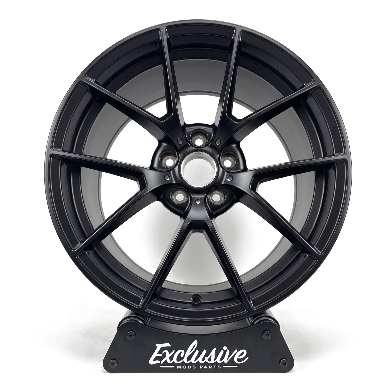 763M style alloy wheel in satin black on the Exclusive Mods Parts display stand, front view