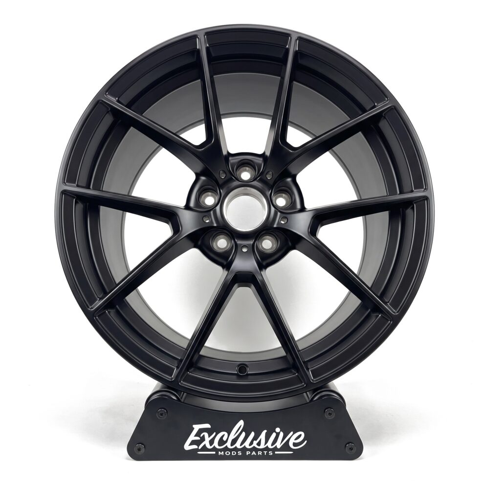 763M style alloy wheel in satin black on the Exclusive Mods Parts display stand, front view