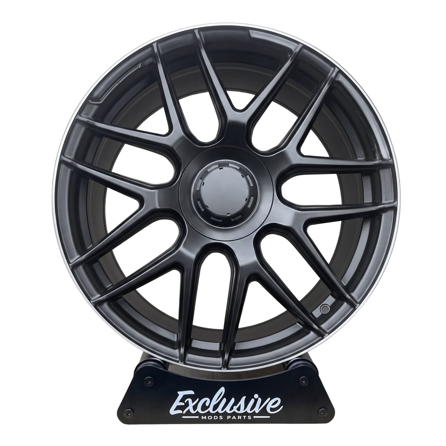 E63 AMG style alloy wheel in matt black with a machined lip on the Exclusive Mods Parts display stand, front view