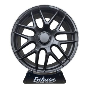 E63 AMG style alloy wheel in matt black with a machined lip on the Exclusive Mods Parts display stand, front view
