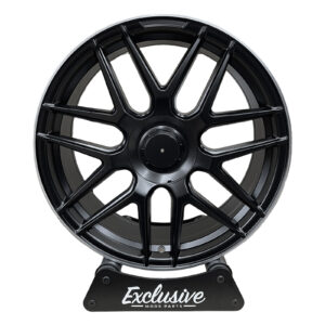 E63 AMG Style alloy wheel in matt black with a machined lip on the Exclusive Mods Parts display stand, front view
